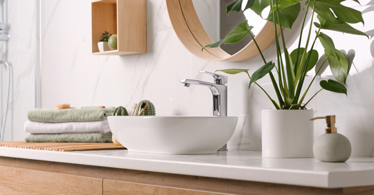 sink on light countertop in modern bathroom