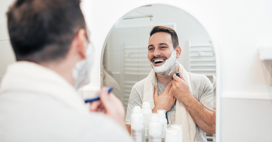 Man shaving beard